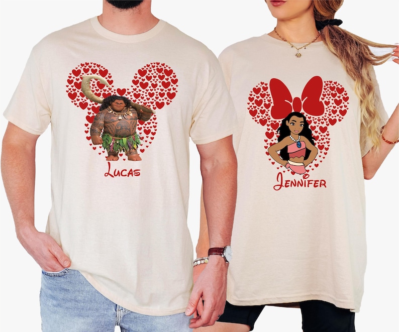 a man and a woman wearing mickey mouse shirts