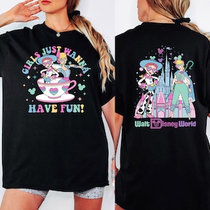 a woman wearing a black tshirt with a cartoon character on it
