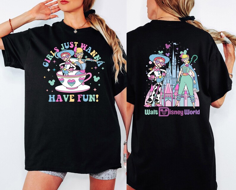 a woman wearing a black tshirt with a cartoon character on it