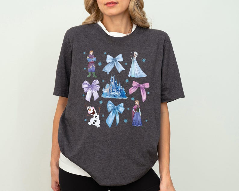 a woman wearing a disney tshirt with princesses on it
