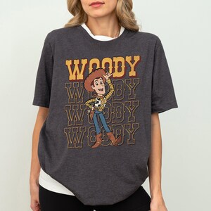 a woman wearing a woody t - shirt with woody on it
