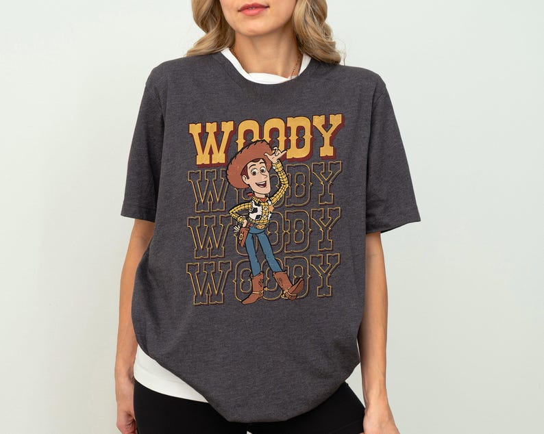 a woman wearing a woody t - shirt with woody on it