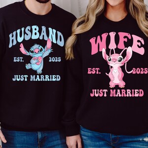 a man and a woman wearing husband and wife sweatshirts
