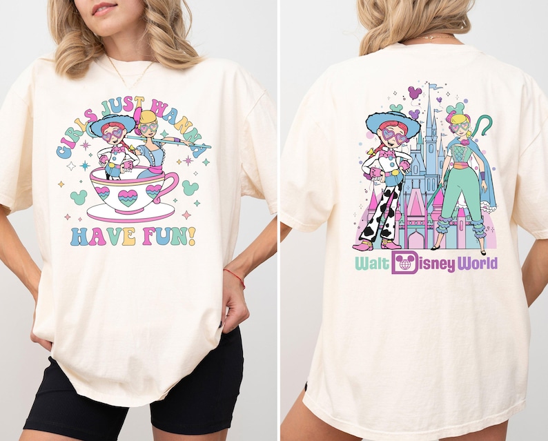 a woman wearing a white shirt with a cartoon character on it