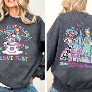 a woman wearing a sweatshirt with a cartoon character on it