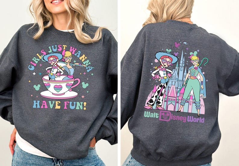 a woman wearing a sweatshirt with a cartoon character on it
