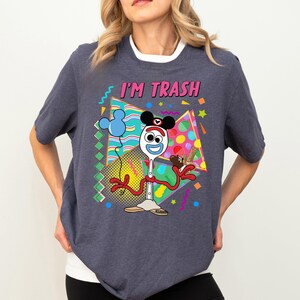 a woman wearing a t - shirt that says i'm trash