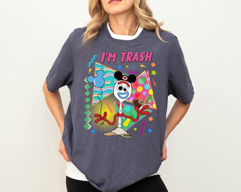 a woman wearing a t - shirt that says i'm trash