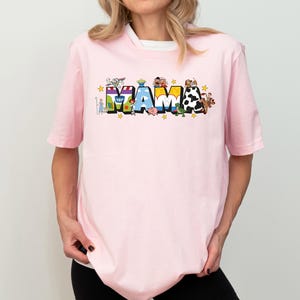 a woman wearing a pink tshirt with the word mash on it