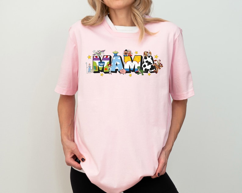 a woman wearing a pink tshirt with the word mash on it