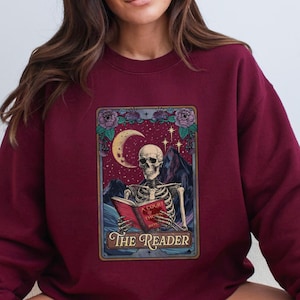 The Reader Tarot Card Sweatshirt, Skeleton Reading Shirt, Unisex Tarot Card Shirt, Book Lover Gift, Bookish Gift,Tarot Lover Gift