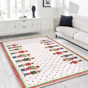 May include: White and red Christmas rug with a repeating pattern of nutcracker soldiers. The rug has a green and gold border.