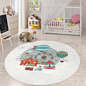 May include: A round, white rug with a colorful circus theme. The rug features a Ferris wheel, hot air balloons, a tent, and a carousel. The rug is perfect for a child's room or play area.