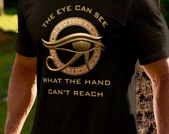 May include: Black t-shirt with a gold graphic of the Eye of Horus and the text "The eye can see what the hand can't reach."