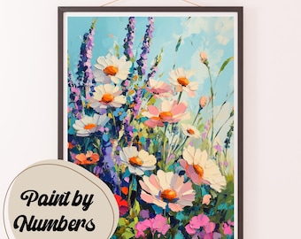 May include: A framed painting of a colorful floral arrangement with white, pink, and purple flowers. The flowers are painted in a realistic style with visible brushstrokes. The background is a light blue sky with white clouds.