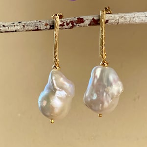 White baroque pearl earrings. Oversized pearl gold bar post earrings. Free form fresh water pearl earrings. 2025 jewelry trend.