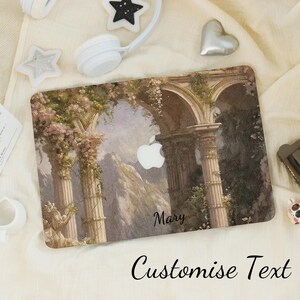 May include: A laptop case featuring a classical architectural design with columns, arches, and floral accents. The case has a personalized name and the text "Customise Text" at the bottom. The Apple logo is visible.