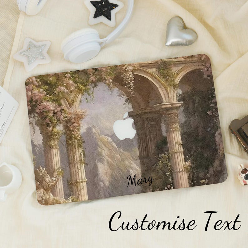 May include: A laptop case featuring a classical architectural design with columns, arches, and floral accents. The case has a personalized name and the text "Customise Text" at the bottom. The Apple logo is visible.