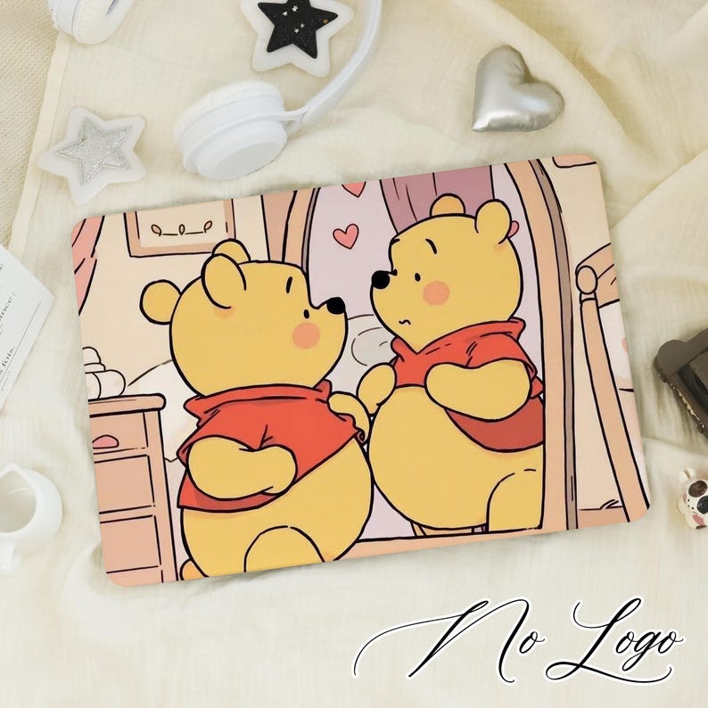 May include: Mouse mat with a cartoon illustration of two yellow bears in red shirts, set against a pink and beige backdrop. The bears are looking at each other, with hearts visible. The words "No Logo" are at the bottom.