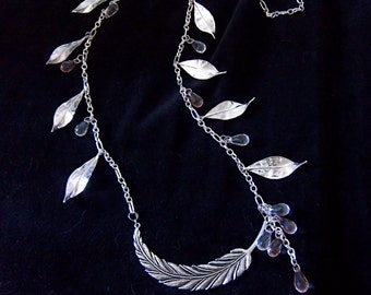 Gorgeous silverplated leaves and faceted teardrop glass beads in clear and blush on a beautiful silverplated chain.