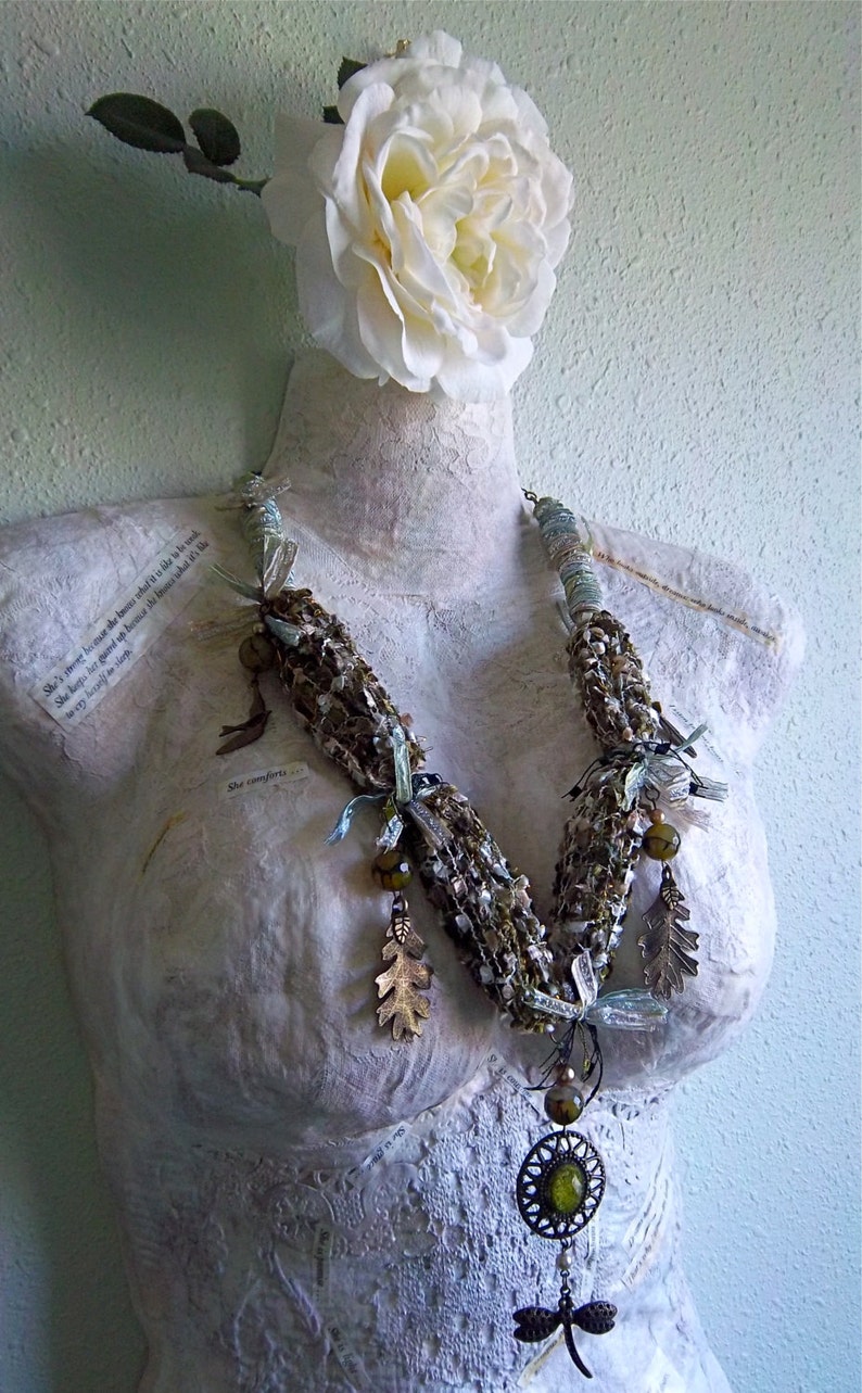 Moss green woven ribbons, yarns, and threads necklace with glass beads, brass charms and green faceted glass pendant statement piece. image 4