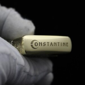 May include: A gold lighter with the word "CONSTANTINE" engraved on the side.