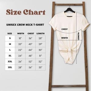 May include: Size chart for a unisex crew neck t-shirt. The chart shows the width, chest, and length measurements in inches for sizes S, M, L, XL, XXL, and 3XL.