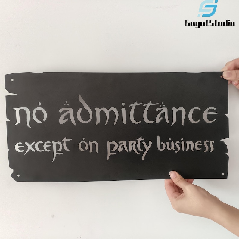 May include: A black rectangular sign with the words "no admittance except on party business" in silver lettering. The sign has a rustic, distressed edge design and is held up by two hands.