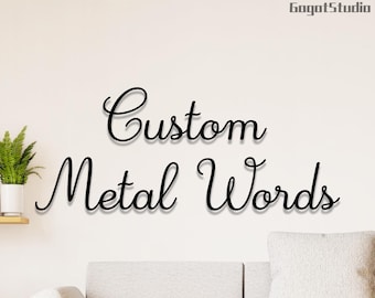 May include: Custom Metal Words, a sign with the words "Custom Metal Words" in a decorative script font.