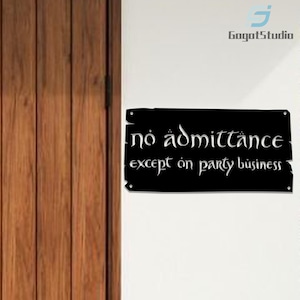 May include: A black rectangular sign with the words "no admittance except on party business" in white, stylized lettering. The sign is mounted on a white wall next to a wooden door.