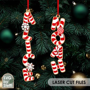 May include: Christmas ornaments spelling out "Alice" and "Noah" in red and white candy cane letters, hanging from red ribbons. The ornaments are decorated with snowflakes and a swirl candy. The background features a Christmas tree with green and gold ornaments.