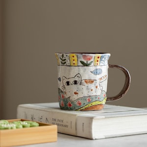 May include: A set of three ceramic vases in varying heights and shapes. The vases are glazed in a matte white finish, offering a minimalist aesthetic. The tallest vase is approximately 25 cm high.