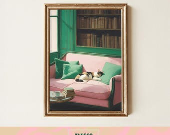 May include: A framed print depicts a cozy interior scene. A pink sofa with green pillows and a resting cat is set against a green wall with a bookshelf. A small table holds books and a teacup. The print is framed in gold.