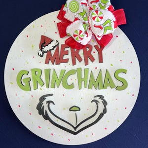 Merry Grinchmas Door Sign | 3D Wooden Holiday Decor | Fun Grinch Grin with Bow | Perfect for Grinch Lovers & Festive Decor