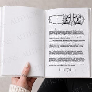 May include: An open book with white pages featuring black printed text and a decorative header illustration of a character's eyes framed by ornate scrollwork. The right page displays a chapter heading with the number one and a matching footer design.