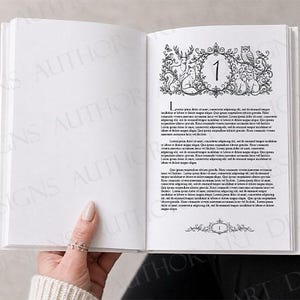 May include: An open book with white pages featuring black printed text and a decorative chapter heading. The heading includes the number 1 surrounded by detailed illustrations of a deer, fox, owl, rabbit, and squirrel within a floral frame.