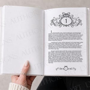 May include: An open book with white pages featuring black printed text and decorative illustrations. The right page displays a large number one inside an ornate frame with a bow at the top, followed by paragraphs of text and a smaller footer graphic.