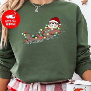 Otter in Santa Hat and Christmas Lights Sweatshirt, Christmas Otter Shirt, Christmas Otter With Santa Hat Shirt,Funny Christmas Animal Shirt