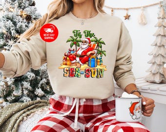Tis the Sea Sun Sweatshirt, Tropical Christmas Shirt, Coastal Christmas, Summer Christmas, Surfer Santa, Holiday Gift, Christmas Shirt