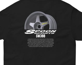 May include: Black t-shirt featuring a white graphic of a silver Spoon Sports SW388 wheel. The text "Spoon Sports SW388" is printed below the wheel.