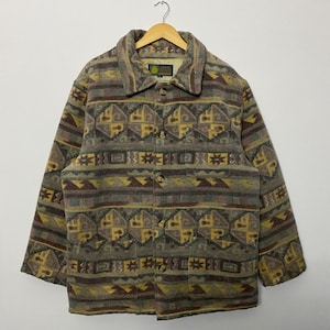 May include: A white ceramic mug with a black handle and the text "But First, Coffee" in a black, handwritten-style font. The mug is on a white surface.