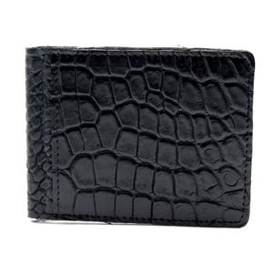 May include: A black bifold wallet featuring a prominent embossed crocodile skin texture. The rectangular accessory displays a glossy finish with large, irregular scale patterns across the entire surface, including a vertical panel on the left side.