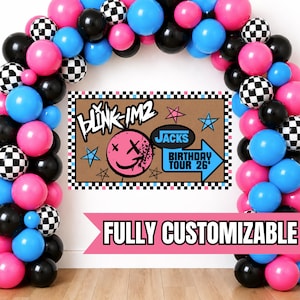 May include: A party backdrop with a balloon arch in pink, black, blue, and checkered patterns. The backdrop features the text "BLINK IM2" and "Jacks Birthday Tour 26". A pink banner at the bottom reads "FULLY CUSTOMIZABLE".