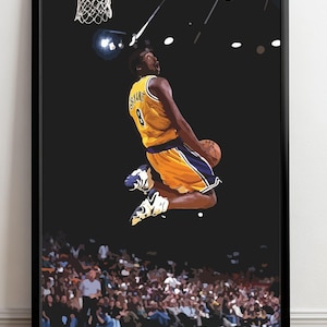 May include: A basketball player wearing a yellow and purple jersey with the number 8 and the name "Bryant" on the back is jumping up to dunk a basketball. The player is in mid-air with the ball in their right hand. The player is in front of a dark background with a basketball hoop and a crowd of people in the background.