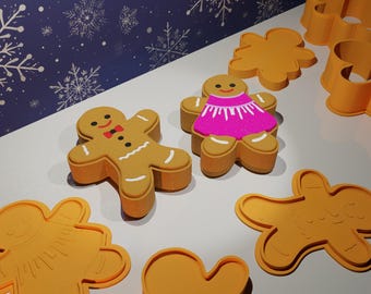 Puede incluir: Un juego de cortadores de galletas de jengibre, que incluye una niña, un niño y una forma tradicional de hombre de jengibre. Los cortadores están hechos de plástico marrón claro y están listos para usarse para hornear.