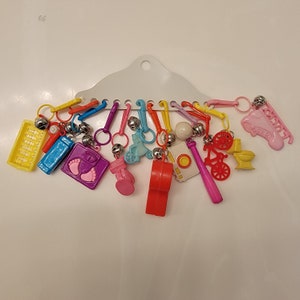 80s vintage bell charms or keychains colorful assortment with camera, toilets plus more. Oh the 80s