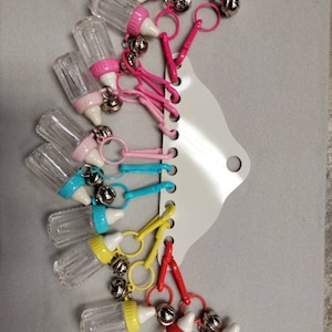 Vintage deadstock bell charms from the Eighties,Baby bottles charms assortment 12 on original card.
