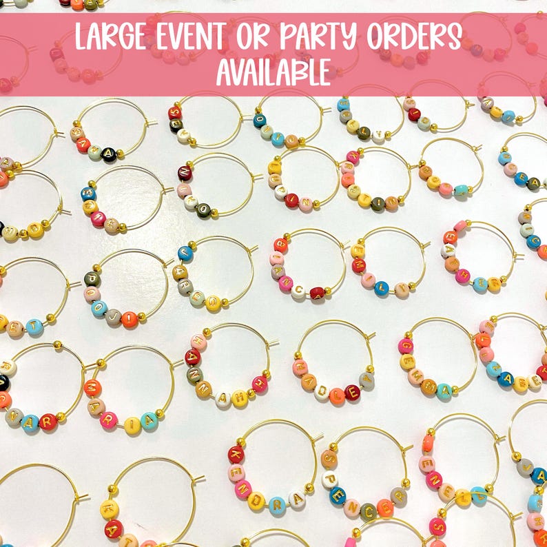 May include: A collection of gold hoop earrings, each adorned with colorful letter beads spelling out various names and words. The earrings are arranged on a white surface, with the text "LARGE EVENT OR PARTY ORDERS AVAILABLE" at the top.