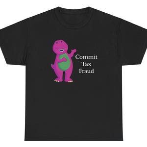 May include: Black t-shirt featuring a purple dinosaur character and the text "Commit Tax Fraud" in white.