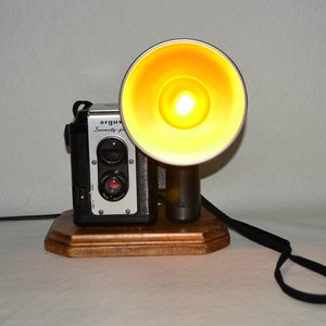 Table Lamp Night Light~Repurposed Upcycled Vintage Argus Seventy Five Camera Lamp w-Perfect Topaz Bulb. Camera is mounted on a wood base.
